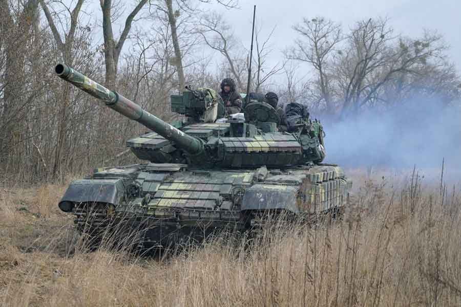 Service members of the Ukrainian armed forces are seen atop of a tank at their positions outside the settlement of Makariv, amid the Russian invasion of Ukraine, on Friday –Reuters file photo