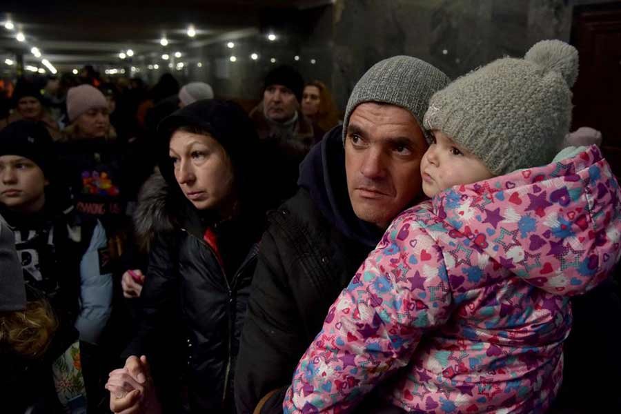 People fleeing Russia's invasion of Ukraine gathering at the train station in Lviv of Ukraine on Wednesday –Reuters photo