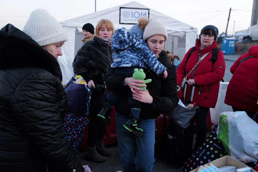 People who fled Ukraine getting into the bus after crossing the border from Ukraine to Poland at the border checkpoint in Medyka of Poland on Sunday –Reuters photo