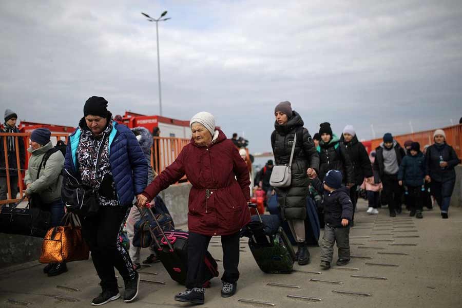 People arriving by ferry at the Isaccea-Orlivka border crossing in Romania on Monday after fleeing war between Russia and Ukraine –Reuters photo