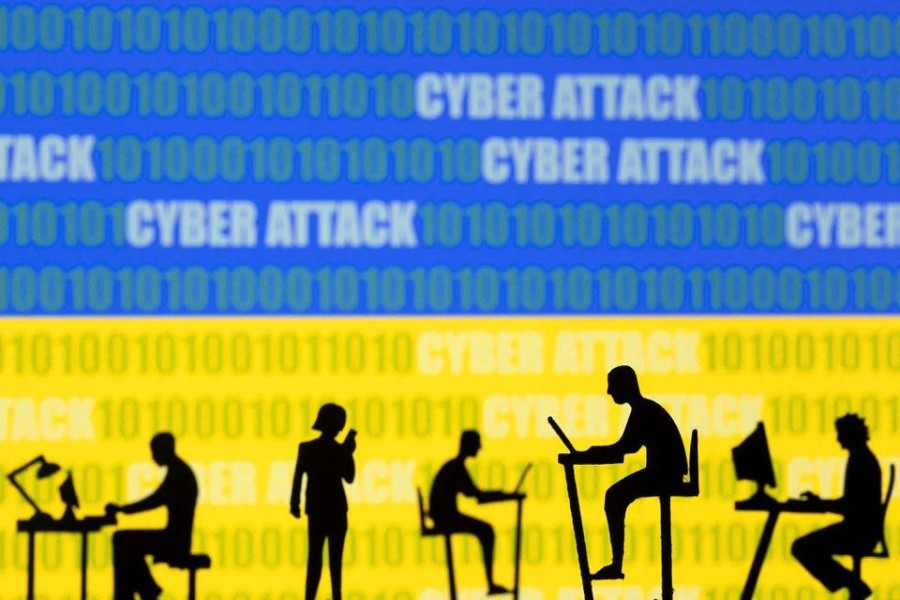 Figurines with computers and smartphones are seen in front of the words "Cyber Attack", binary codes and the Ukrainian flag, in this illustration taken February 15, 2022. REUTERS/Dado Ruvic/Illustration/File Photo