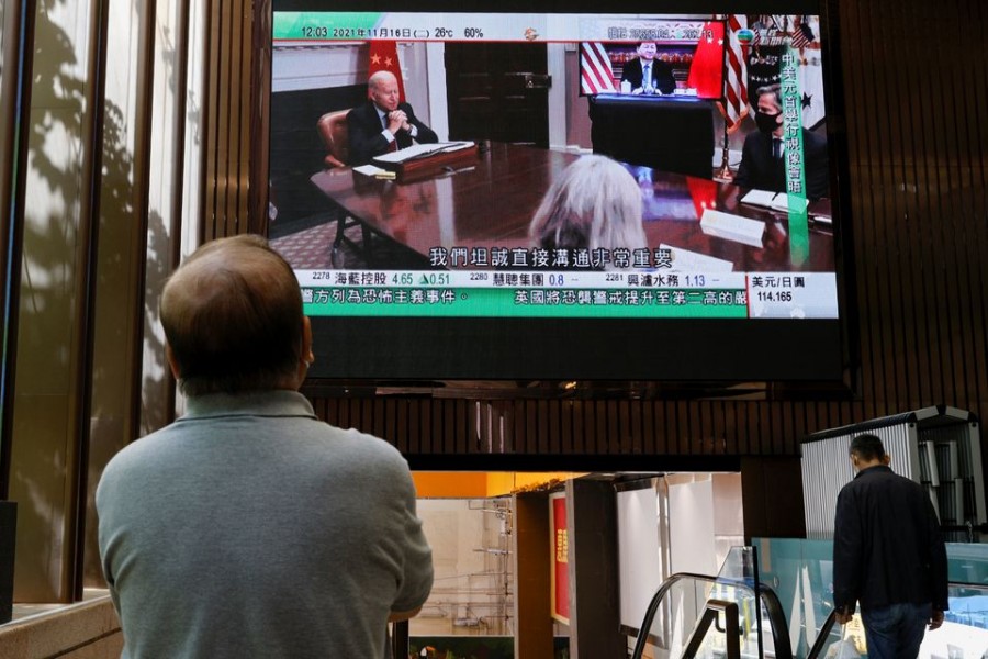 A TV screen shows news of a video meeting between US President Joe Biden and Chinese President Xi Jinping, in Hong Kong, China on November 16, 2021 — Reuters/Files