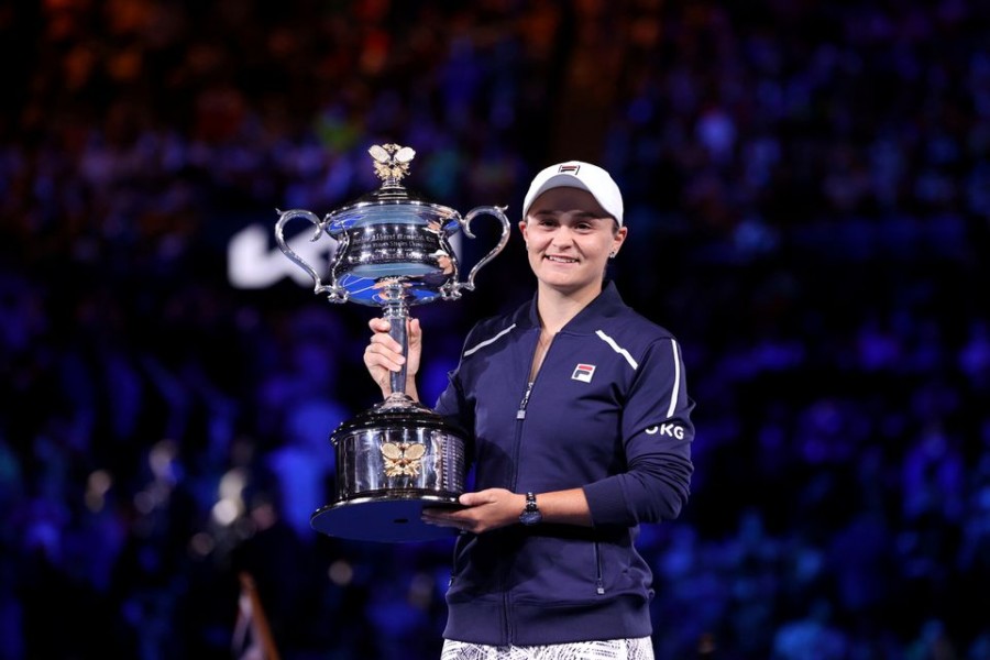 Tennis - Australian Open - Women's Singles Final - Melbourne Park, Melbourne, Australia - January 29, 2022 Australia's Ashleigh Barty poses as she celebrates winning the final against Danielle Collins of the U.S. with the trophy REUTERS/Loren Elliott