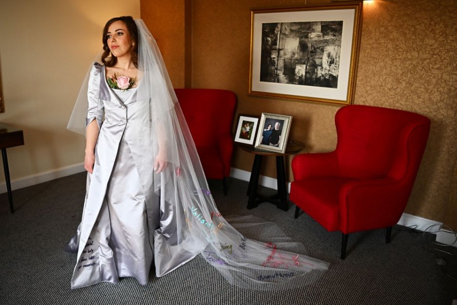 Stella Moris, the partner of Wikileaks founder Julian Assange, is photographed in her Vivienne Westwood designed wedding dress before driving to Belmarsh Prison where she is due to marry Julian Assange, at a hotel in London, Britain March 23, 2022. REUTERS/Dylan Martinez/Pool