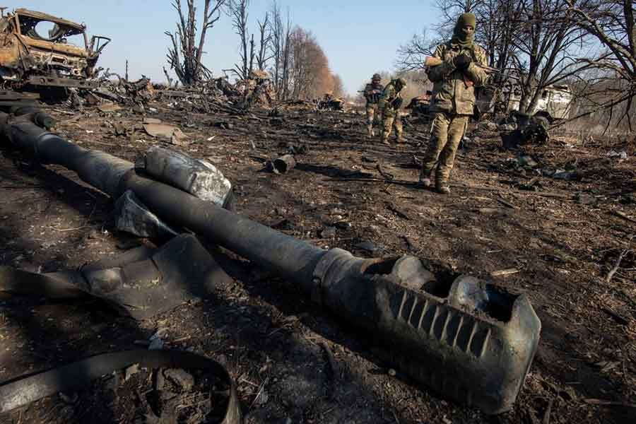 Ukrainian service members inspecting destroyed Russian military vehicles near the town of Trostianets in the Sumy region on Friday –Reuters photo