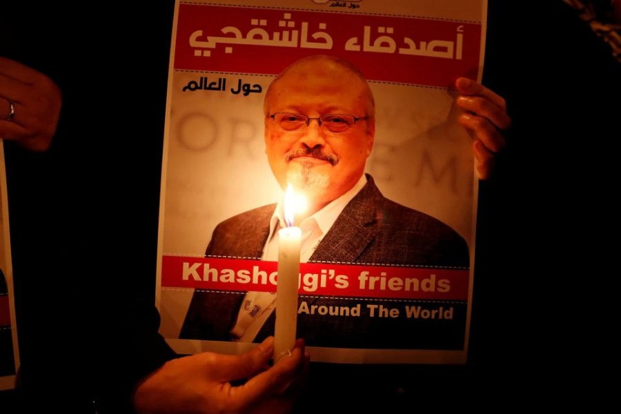 A demonstrator holds a poster with a picture of Saudi journalist Jamal Khashoggi outside the Saudi Arabia consulate in Istanbul, Turkey October 25, 2018. REUTERS/Osman Orsal/File Photo