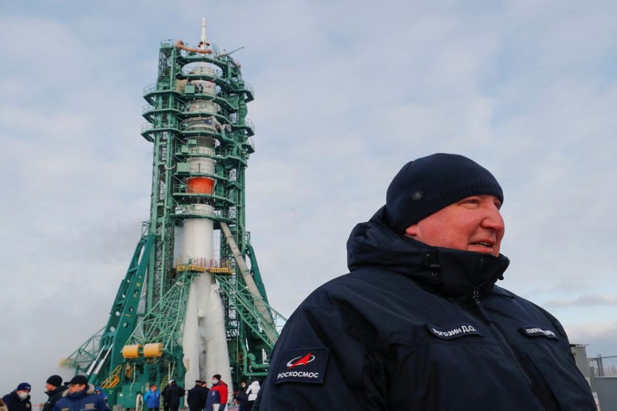 Director General of Roscosmos Dmitry Rogozin walks in front of the Soyuz MS-20 spacecraft as it rests on its launchpad shortly before the blast off with Roscosmos cosmonaut Alexander Misurkin, space flight participant Japanese entrepreneur Yusaku Maezawa and his production assistant Yozo Hirano to the International Space Station (ISS) at the Baikonur Cosmodrome, Kazakhstan, December 8, 2021. REUTERS/Shamil Zhumatov/Pool