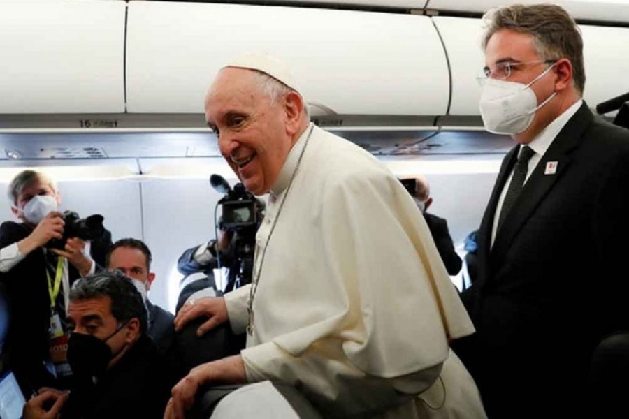 Pope Francis stands aboard the plane on his way to Malta International Airport, ahead of his apostolic visit in Luqa, Malta, Apr 2, 2022. REUTERS/Remo Casilli/Pool