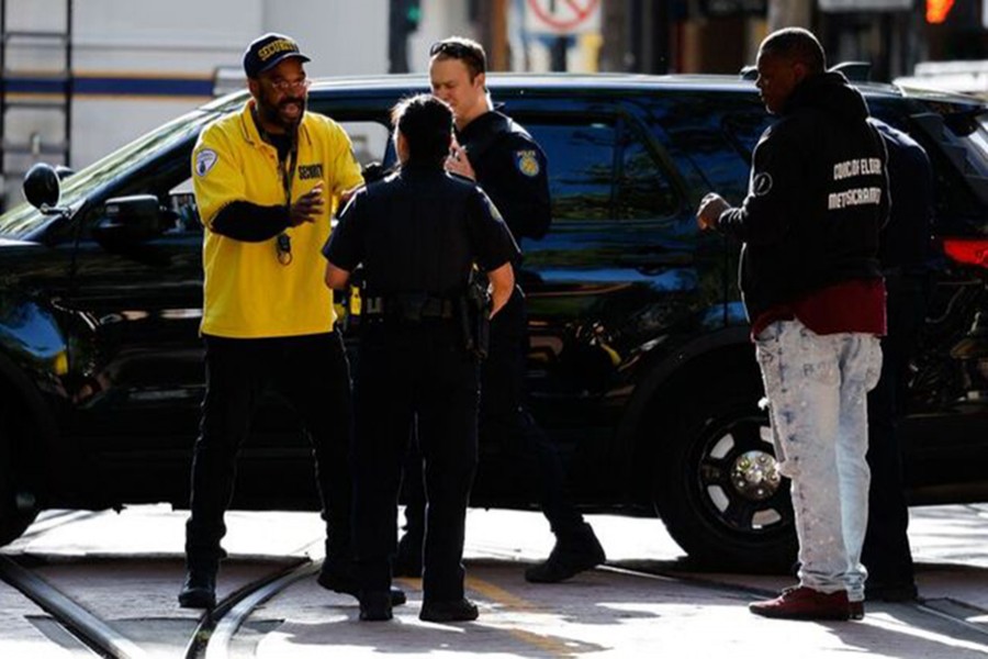 Frank Turner, father of DeVazia Turner, 29, who died in an early-morning shooting in a stretch of downtown near the Golden 1 Center arena, talks to police officers, in Sacramento, California, US on April 3, 2022 — Reuters photo