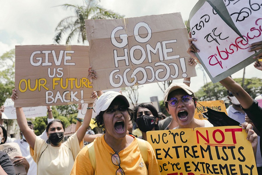 People shout slogans against Sri Lanka's President Gotabaya Rajapaksa and demand that Rajapaksa family politicians step down, during a protest amid the country's economic crisis, at Independence Square in Colombo, Sri Lanka on April 4, 2022 — Reuters photo