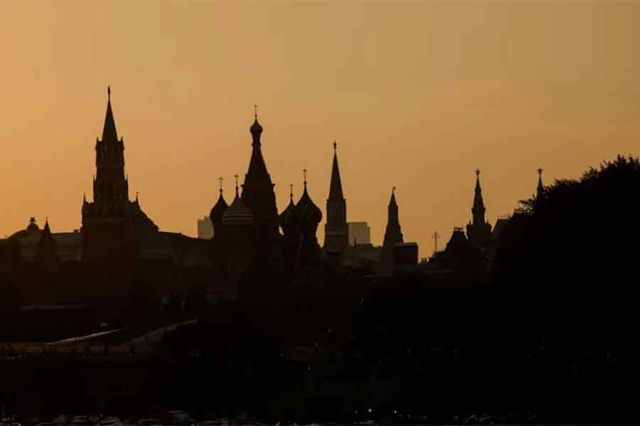 St. Basil's Cathedral and towers of Kremlin are silhouetted against the sunset in Moscow –Reuters file photo