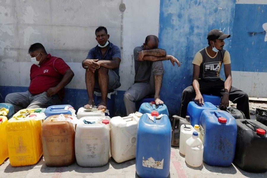 A man rests while waiting in a line to buy diesel near a Ceylon Petroleum Corporation fuel station, amid the country's economic crisis in Colombo, Sri Lanka, April 7, 2022 – Reuters