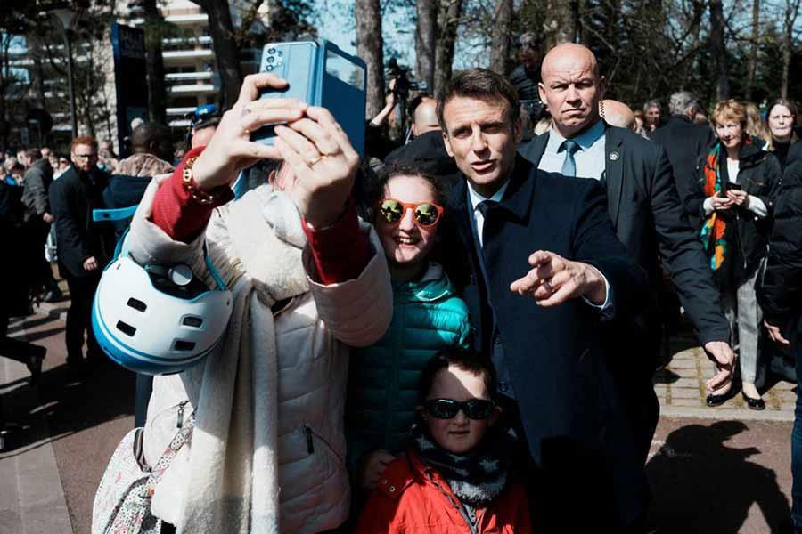 French President and centrist presidential candidate for re-election Emmanuel Macron reacting as he meets residents on the day of the first round of the presidential election in Le Touquet of northern France on Sunday –Reuters photo