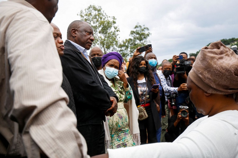 President Cyril Ramaphosa meets with people who lost family members during flooding in Clermont, Durban, South Africa on April 13, 2022 — Reuters photo