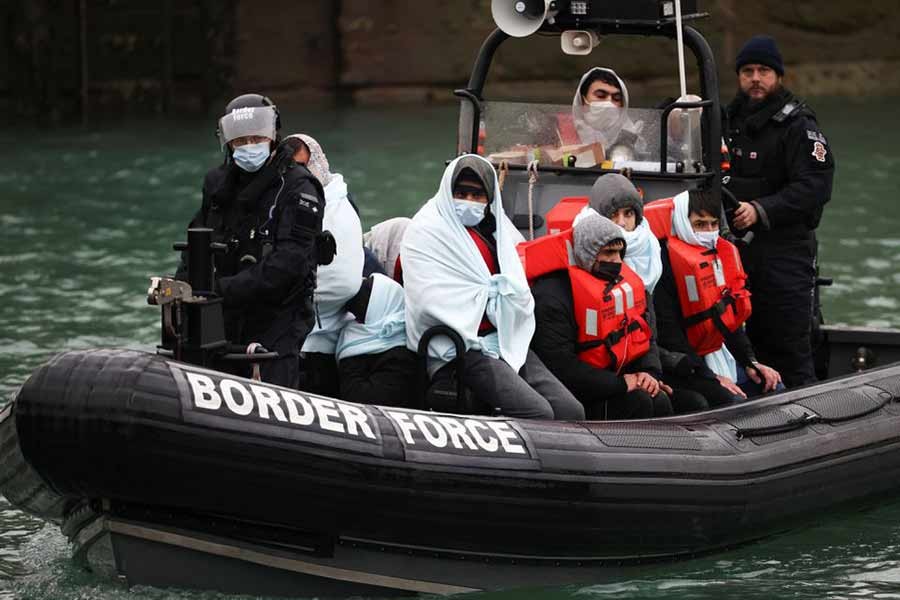 Migrants arriving into the Port of Dover on a Border Force vessel after being rescued while crossing the English Channel in Dover of Britain on December 17 in 2021 –Reuters file photo