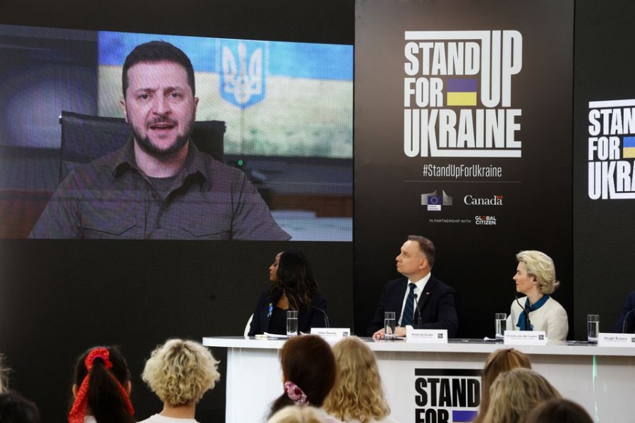 Ukrainian President Volodymyr Zelenskiy is seen on a screen as he participates remotely in a global event titled 'Stand Up For Ukraine' along with European Commission President Ursula von der Leyen and Polish President Andrzej Duda, at the Palace on the Isle in Royal Lazienki Park in Warsaw, Poland, April 9, 2022. REUTERS/Kacper Pempel