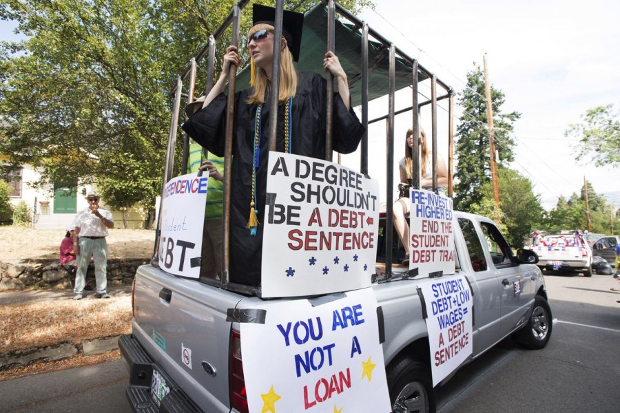 Parade participants protesting against high student loan burdens are preparing to take part in the annual July 4th parade at Ashland, Oregon, U.S. on July 4, 2015. REUTERS/Randall Mikkelsen/File Photo