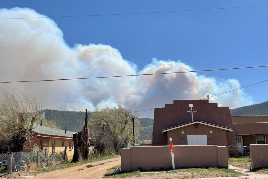 Smoke from the Calf Canyon fire is seen from Mora village, New Mexico, U.S., April 29, 2022. REUTERS/Andrew Hay