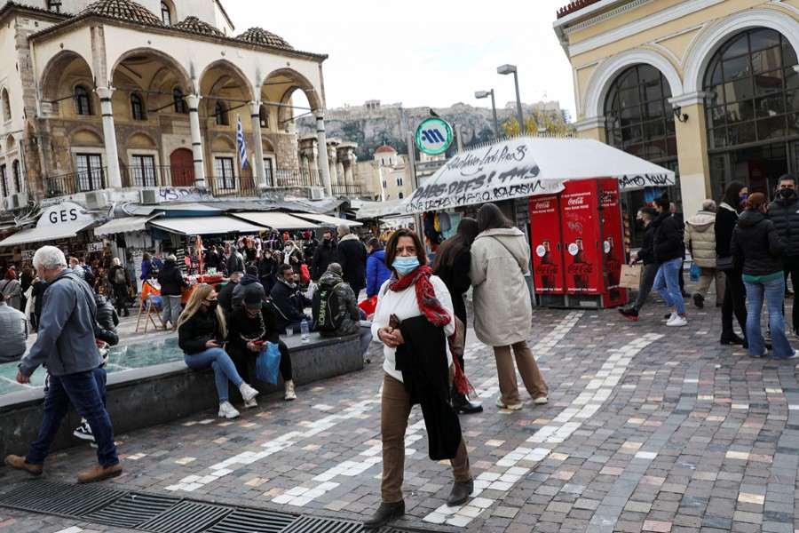 People wearing protective face masks make their way to Monastiraki square amid the coronavirus disease (Covid-19) outbreak, in Athens, Greece on December 29, 2021 — Reuters/Files