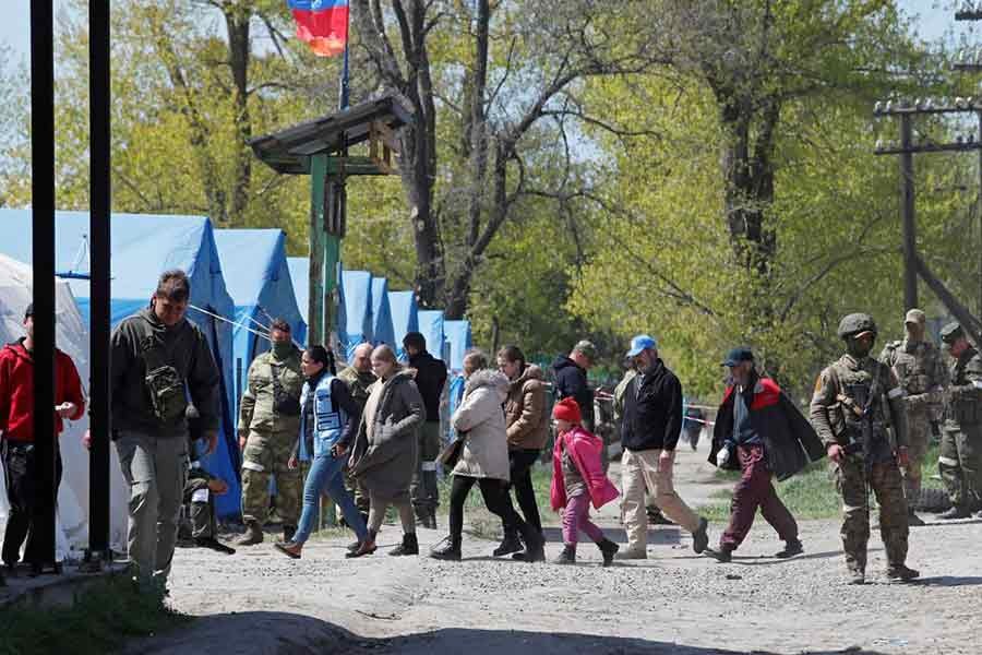 Civilians who left the area near Azovstal steel plant in Mariupol walking accompanied by UN staff at a temporary accommodation centre during Ukraine-Russia conflict in the village of Bezimenne in the Donetsk Region of Ukraine on Sunday –Reuters photo