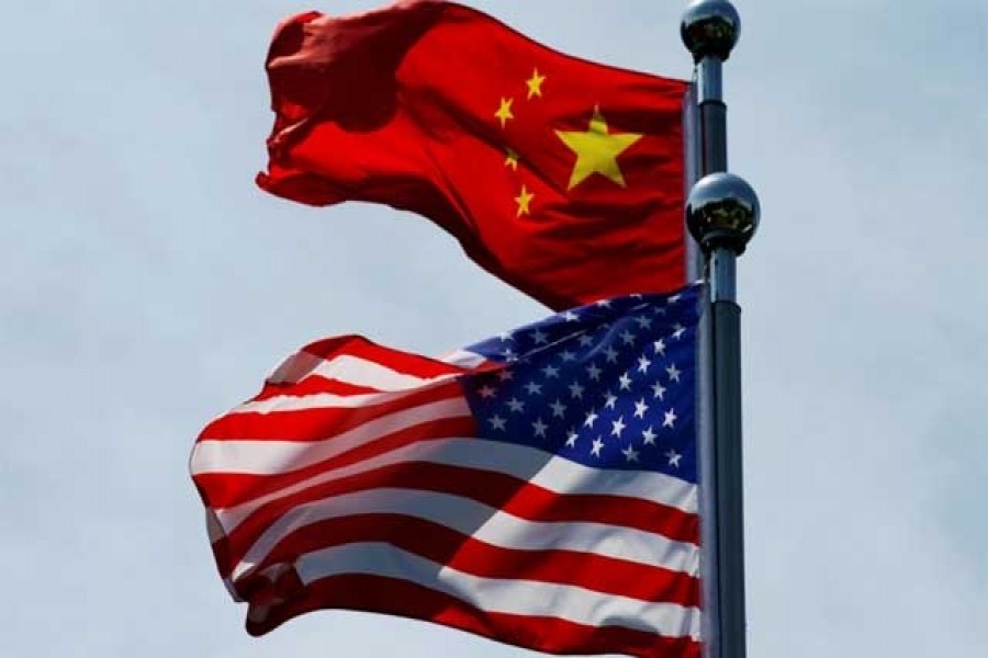 Chinese and US flags flutter near the Bund in Shanghai, China July 30, 2019 — Reuters