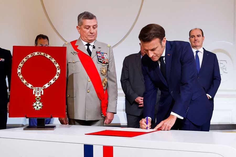 French President Emmanuel Macron signing a document after taking the oath of office for a second term as president during a ceremony at the Elysee Palace in Paris of France on Saturday –Reuters Photo