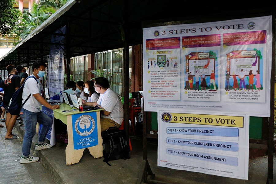 Filipinos attend a polling precinct during the national elections in Manila, Philippines on May 9, 2022 — Reuters photo