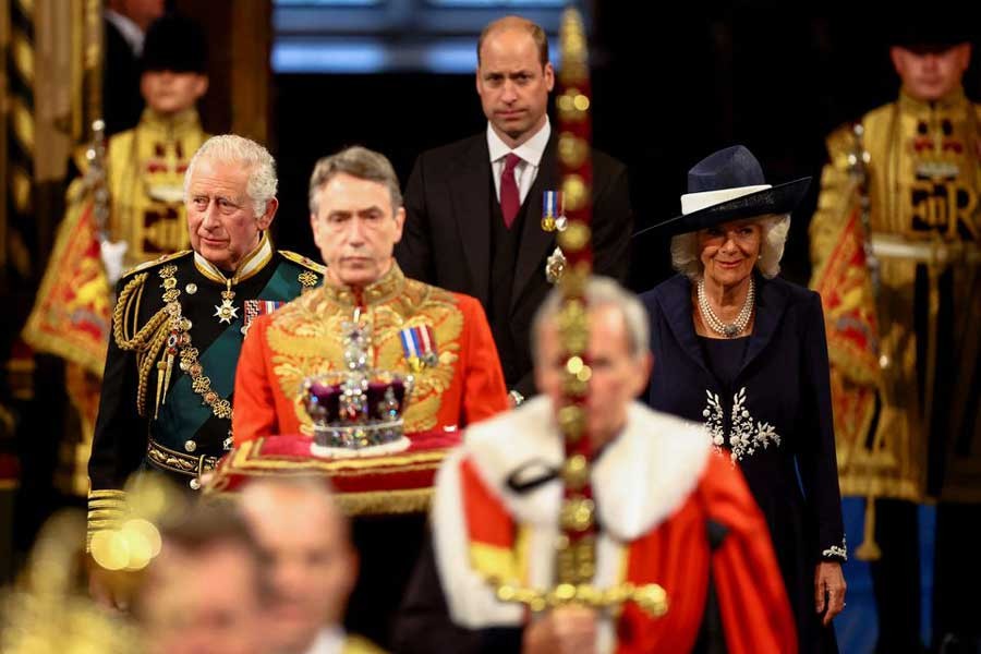 Britain's Prince Charles, Camilla, Duchess of Cornwall, and Prince William proceeding behind the Imperial State Crown through the Royal Gallery for the State Opening of Parliament at the Palace of Westminster in London on Tuesday –Reuters photo