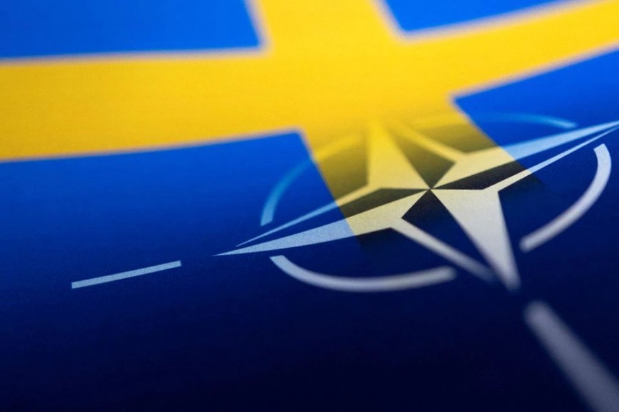 Swedish and NATO flags are seen printed on paper this illustration taken April 13, 2022. REUTERS/Dado Ruvic/Illustration/File Photo