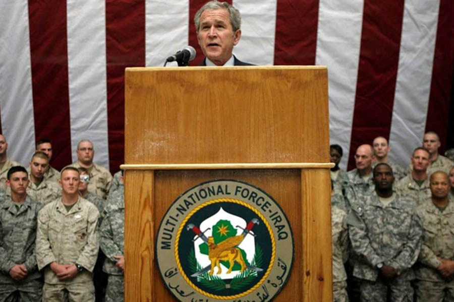 US President George W Bush speaks to US troops from Al Faw Palace at Camp Victory in Baghdad Dec 14, 2008. REUTERS/Kevin Lamarque (IRAQ)/File