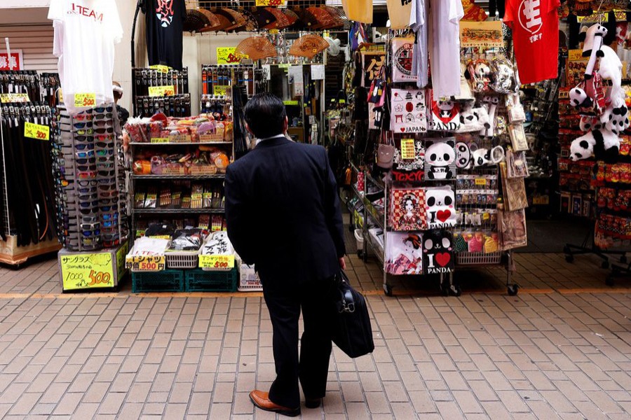 A man looks at a shop at the Ameyoko shopping district in Tokyo, Japan on May 20, 2022 — Reuters photo