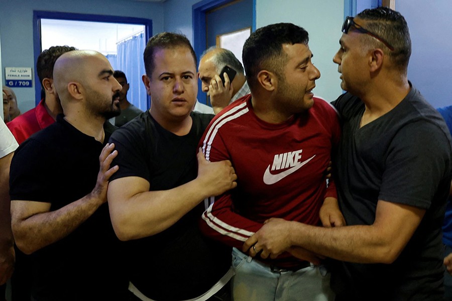 People react at a hospital after a Palestinian woman was killed in an incident at an Israeli checkpoint, in Hebron in the Israeli-occupied West Bank on June 1, 2022 — Reuters photo