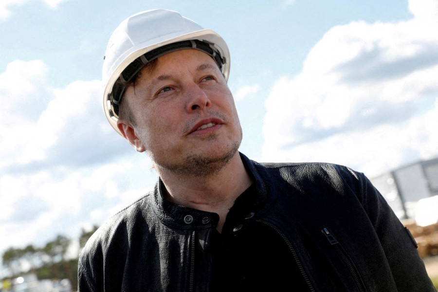 SpaceX founder and Tesla CEO Elon Musk looks on as he visits the construction site of Tesla's gigafactory in Gruenheide, near Berlin, Germany, May 17, 2021. REUTERS/Michele Tantussi/File Photo