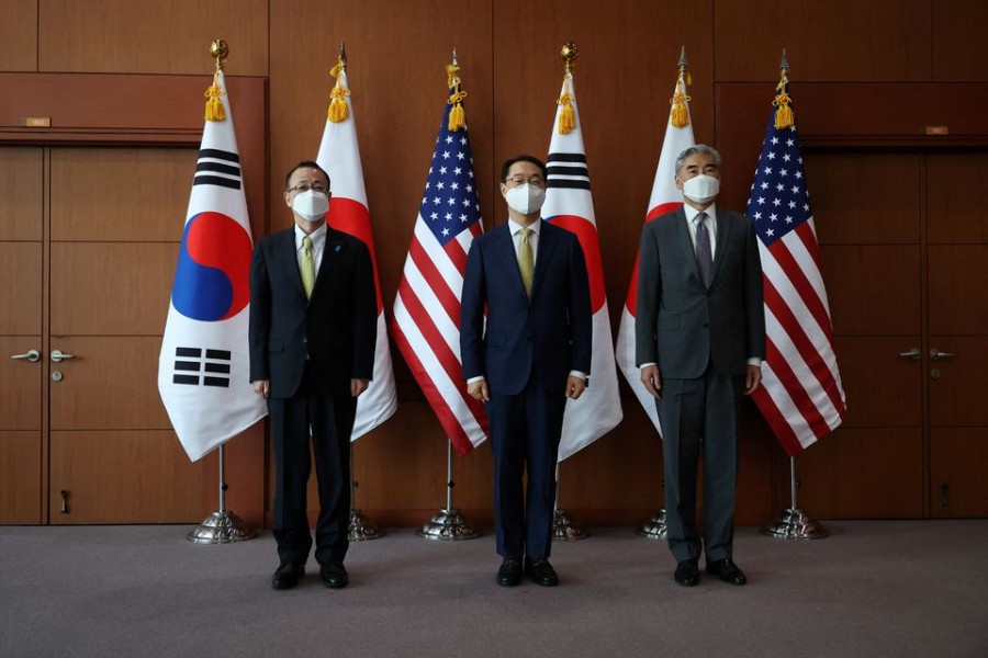 Kim Gunn, South Korea's new special representative for Korean Peninsula peace and security affairs, his US counterpart Sung Kim and Japanese counterpart Takehiro Funakoshi pose for photographs before their meeting at the Foreign Ministry in Seoul, South Korea on June 3, 2022 — Pool via Reuters
