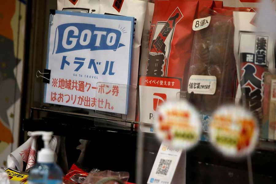 A sign for 'Go To Travel' campaign, a Japanese government-backed travel discount programme encouraging domestic travel to help boost the economy, is displayed at a souvenir shop along Nakamise Street at Asakusa district in Tokyo of Japan in 2020 –Reuters file photo