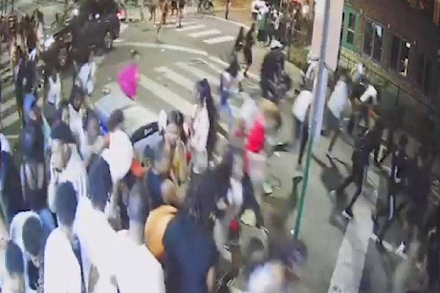 A screen grab from a surveillance video from the shooting shows people on a crowded street running in panic, presumably after gun shots were fired, in Philadelphia, Pennsylvania, U.S., June 4, 2022. South Street CCTV via REUTERS