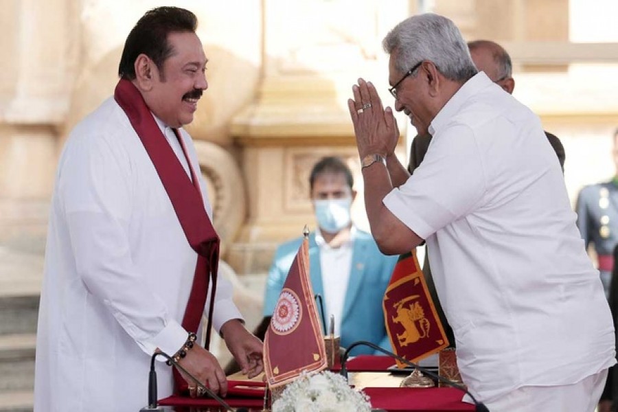 FILE PHOTO: Sri Lanka's former prime minister Mahinda Rajapaksa (L) and his brother, President Gotabaya Rajapaksa, are seen in this picture taken in Colombo, Sri Lanka, Aug 9, 2020. Reuters