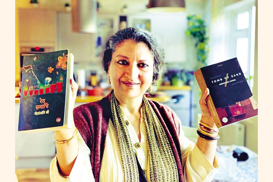 International Booker Prize 2022 winner Geetanjali Shree with her awarded book Ret Samadhi (Hindi) and its English version titled Tomb of Sand