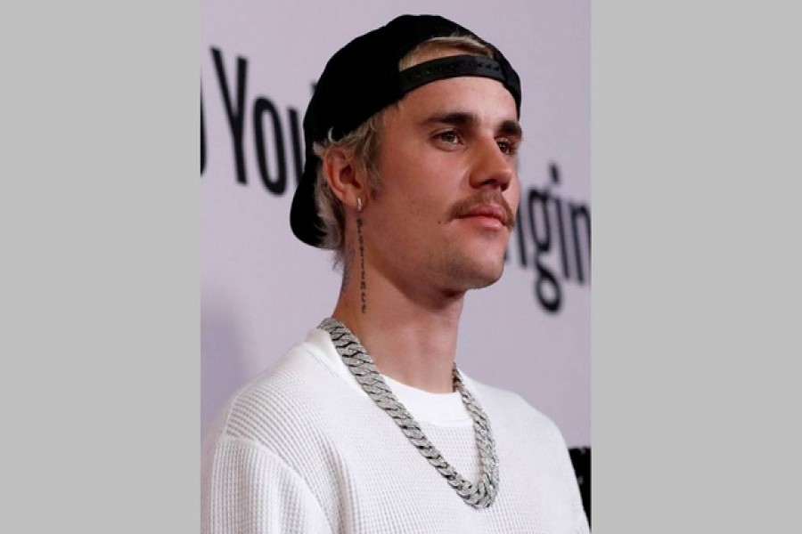 FILE PHOTO: Singer Justin Bieber poses at the premiere for the documentary television series "Justin Bieber: Seasons" in Los Angeles, California, US, January 27, 2020. Reuters