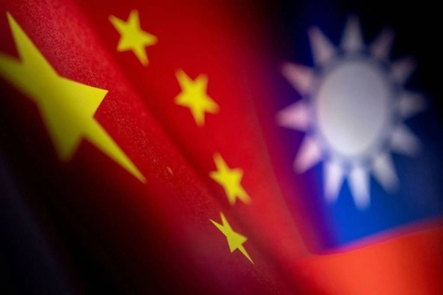 Chinese and Taiwanese printed flags are seen in this illustration taken, April 28, 2022. REUTERS/Dado Ruvic/Illustration/File Photo