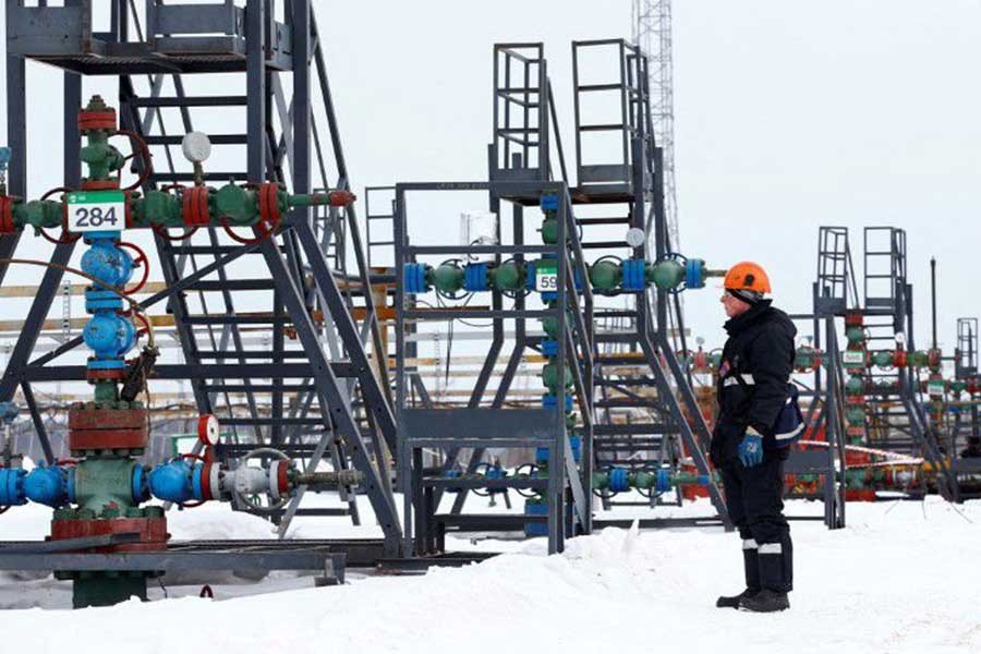 An employee inspecting a well head in the Yarakta Oil Field, owned by Irkutsk Oil Company (INK), in Irkutsk Region of Russia in 2019 –Reuters file photo