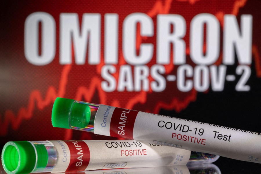 Test tubes labelled "COVID-19 Test Positive" are seen in front of displayed words "OMICRON SARS-COV-2" in this illustration taken on December 11, 2021— Reuters/Files