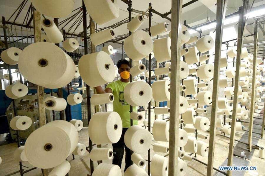 A worker is seen at a textile factory in Gazipur. Developed country's economic turmoil influences economic activities in developing countries like Bangladesh through the trade channel, impacting net exports. —Xinhua Photo