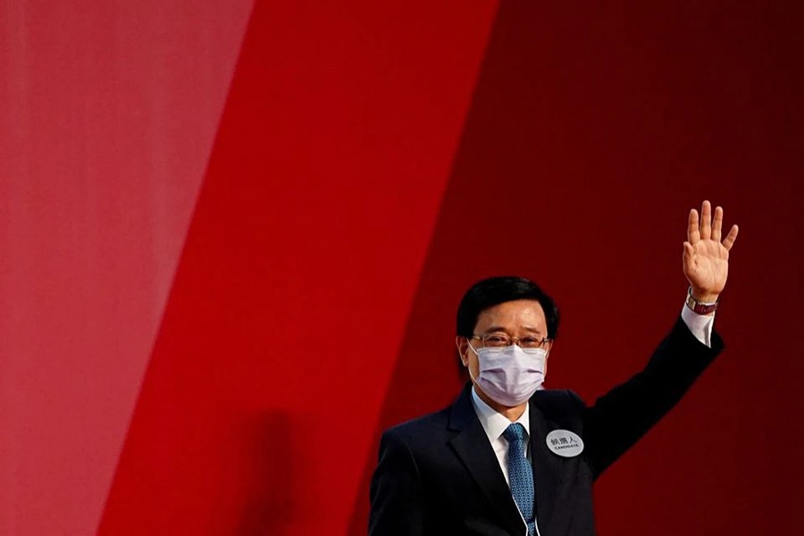 John Lee waves after being elected as Hong Kong's Chief Executive, in Hong Kong, China on May 8, 2022 — Reuters/Files