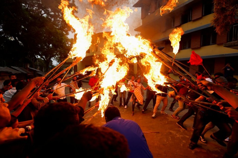 Students affiliated with the main opposition party hold a torch rally during the protest against the rise in fuel prices in Kathmandu, Nepal June 20, 2022. REUTERS/Navesh Chitrakar