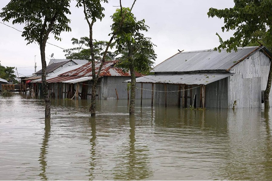 A general view shows a flooded area following heavy monsoon rainfalls in Sunamganj's Chhatak on June 20, 2022 — Focus Bangla photo