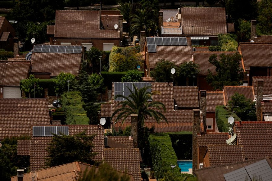 Solar panels are seen on the roofs of homes at the well-to-do suburb of Rivas-Vaciamadrid, south of Madrid, Spain, June 6, 2022. REUTERS/Susana Vera