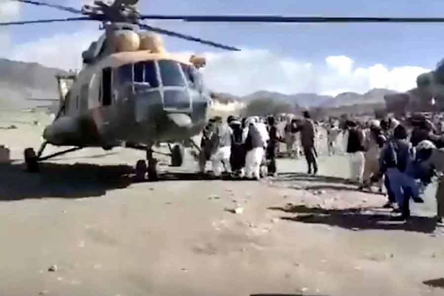 People carrying injured people to a helicopter following a massive earthquake in Paktika Province of Afghanistan on Wednesday –Reuters photo