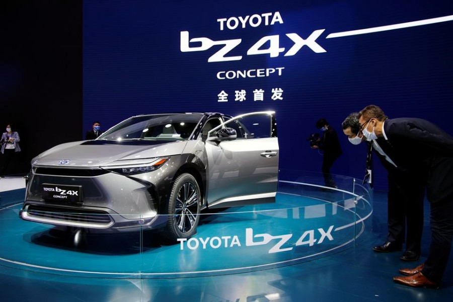 Visitors check a Toyota BZ4X Concept electric vehicle (EV) during its world premiere on a media day for the Auto Shanghai show in Shanghai, China April 19, 2021. REUTERS/Aly Song