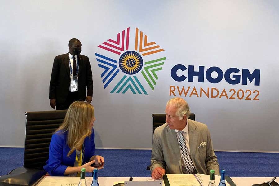Britain's Prince Charles getting briefed by an aide before attending the Heads of Government and CEOs roundtable during Commonwealth Heads of Government Meeting (CHOGM) at the Intare conference arena on the outskirts of Kigali  in Rwanda on Thursday –Reuters photo